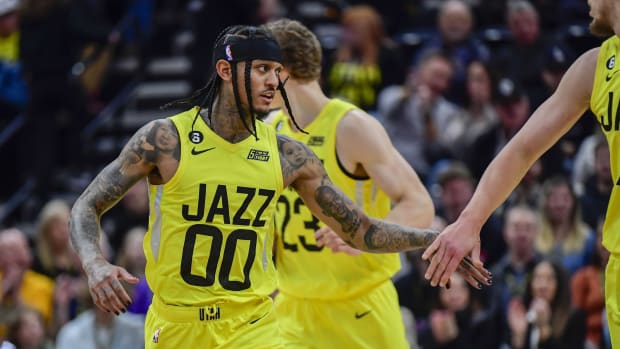 Utah Jazz forward/center Kelly Olynyk (41) congratulates guard Jordan Clarkson (00) after a basket against the Atlanta Hawks during the first half at Vivint Arena.